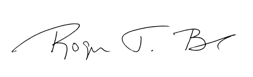 A blue writing on a white surfaceDescription automatically generated